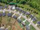 Aerial view of home in community with a community pool and lush landscaping at 138 Brookhaven Dr, Villa Rica, GA 30180