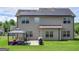 Exterior back of home featuring solar panels and a well-manicured lawn at 138 Brookhaven Dr, Villa Rica, GA 30180