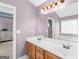 Bright bathroom featuring a double vanity, tub, and neutral color palette at 138 Brookhaven Dr, Villa Rica, GA 30180