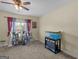 Bright bedroom featuring neutral walls, carpet floors, plants, and a fish tank at 138 Brookhaven Dr, Villa Rica, GA 30180