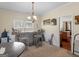 Dining area featuring a custom bar, chandelier and wainscoting at 138 Brookhaven Dr, Villa Rica, GA 30180