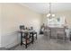 Dining area with breakfast bar, stylish chandelier, and neutral decor at 138 Brookhaven Dr, Villa Rica, GA 30180