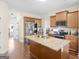 Modern kitchen with stainless steel appliances, granite counters, and wood floors at 138 Brookhaven Dr, Villa Rica, GA 30180