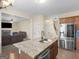 Beautiful kitchen featuring granite countertops, stainless steel appliances, and open floor plan at 138 Brookhaven Dr, Villa Rica, GA 30180