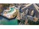 Stunning aerial view of the lakeside property with a swimming pool and beautiful architecture at 504 Mill Pond Se Ct, Smyrna, GA 30082
