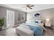 Beautifully staged bedroom featuring a large window and stylish decor at 504 Mill Pond Se Ct, Smyrna, GA 30082