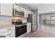 Well-equipped kitchen featuring stainless steel appliances, modern cabinetry and great lighting at 504 Mill Pond Se Ct, Smyrna, GA 30082
