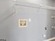 A utility closet featuring washing machine hookups and metal wire shelving at 504 Mill Pond Se Ct, Smyrna, GA 30082