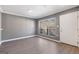 This living room features modern flooring, neutral paint and large bright windows at 504 Mill Pond Se Ct, Smyrna, GA 30082