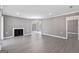 Spacious living room featuring modern flooring, neutral walls and a fireplace at 504 Mill Pond Se Ct, Smyrna, GA 30082
