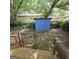 View of the backyard showcasing a blue storage shed, chain link fence and an abundance of green foliage at 1761 Hosea L Williams Dr, Atlanta, GA 30317