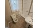 Bathroom featuring modern tile surround, hand rails, and a toilet at 1761 Hosea L Williams Dr, Atlanta, GA 30317
