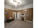 Bedroom featuring wood walls, carpet flooring, and a fireplace at 1761 Hosea L Williams Dr, Atlanta, GA 30317