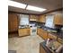 Cozy kitchen featuring wood cabinets, standard appliances, and a functional layout at 1761 Hosea L Williams Dr, Atlanta, GA 30317