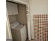 Laundry room showcasing a white washing machine and dryer, cabinets, and decorative wall art at 1761 Hosea L Williams Dr, Atlanta, GA 30317
