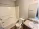 Bathroom featuring a tub, toilet, vanity with sink, and modern fixtures for convenience and comfort at 1464 Riverrock Trl, Riverdale, GA 30296