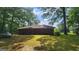 Expansive backyard view with mature trees, providing shade and privacy for outdoor enjoyment at 305 Flat Shoals Church Rd, Stockbridge, GA 30281