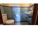 Retro bathroom featuring blue tiles, a pedestal sink, and a white toilet at 305 Flat Shoals Church Rd, Stockbridge, GA 30281