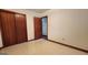 This bedroom features tile floors, a closet, and an ensuite at 305 Flat Shoals Church Rd, Stockbridge, GA 30281