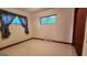 Cozy bedroom featuring tile flooring, a window, and trim throughout the space at 305 Flat Shoals Church Rd, Stockbridge, GA 30281