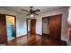Comfortable bedroom with wood flooring, closet and an attached bathroom with blue tiles at 305 Flat Shoals Church Rd, Stockbridge, GA 30281