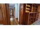 Hallway view with wooden accents and storage shelving at 305 Flat Shoals Church Rd, Stockbridge, GA 30281