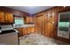 Functional kitchen with wood cabinetry, white appliances, and ample natural light at 305 Flat Shoals Church Rd, Stockbridge, GA 30281