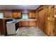 Classic kitchen with wood cabinets, white appliances, and a cozy atmosphere at 305 Flat Shoals Church Rd, Stockbridge, GA 30281