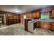 Eat-in kitchen with vintage wood cabinets, white countertops, and an open layout at 305 Flat Shoals Church Rd, Stockbridge, GA 30281