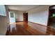 Inviting living room featuring gleaming hardwood floors and a decorative front door at 305 Flat Shoals Church Rd, Stockbridge, GA 30281