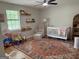 Cozy Bedroom with hardwood floors, and a woven basket with toys at 126 Country Acres Ct, Mcdonough, GA 30253