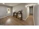 Open-concept entryway with wood floors, neutral paint, and decoratively appointed console table at 126 Country Acres Ct, Mcdonough, GA 30253