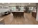 Spacious kitchen with island seating and updated appliances, perfect for gatherings at 126 Country Acres Ct, Mcdonough, GA 30253