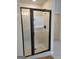 Modern bathroom featuring a walk-in shower with sleek black frame and tiled walls at 436 Lothbury Ave, Locust Grove, GA 30248