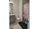 This bathroom features a vanity with a gray cabinet and a shower-tub combination with a unique shower curtain at 436 Lothbury Ave, Locust Grove, GA 30248