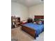 Comfortable bedroom features a full bed, a wooden bookcase, and a toybox at 436 Lothbury Ave, Locust Grove, GA 30248
