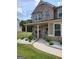 Inviting exterior with a covered porch, perfect for enjoying the outdoors, surrounded by a well-maintained lawn at 436 Lothbury Ave, Locust Grove, GA 30248