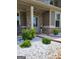 Charming front porch featuring decorative stone and lush greenery, creating a welcoming entrance to the home at 436 Lothbury Ave, Locust Grove, GA 30248