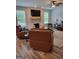 Relaxing living room with fireplace and mounted TV, bathed in natural light at 436 Lothbury Ave, Locust Grove, GA 30248