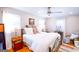Comfortable main bedroom with a ceiling fan and plenty of natural light at 577 Rivers Rd, Fayetteville, GA 30214