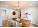 Cozy dining room features wood table and accent decor at 577 Rivers Rd, Fayetteville, GA 30214