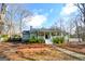 Charming home with a welcoming front porch and well-maintained yard at 577 Rivers Rd, Fayetteville, GA 30214