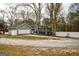 Exterior view of home, showcasing the garage, carport, and backyard at 577 Rivers Rd, Fayetteville, GA 30214