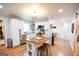Open kitchen with island, stainless appliances, and eat-in dining area at 577 Rivers Rd, Fayetteville, GA 30214