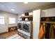 Functional laundry room with cabinetry, storage, and a folding area at 577 Rivers Rd, Fayetteville, GA 30214