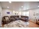 Cozy living room featuring a comfortable sectional, recessed lighting and open sight lines at 577 Rivers Rd, Fayetteville, GA 30214