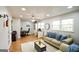 Inviting living room features hardwood floors, a ceiling fan, and plenty of sunlight at 577 Rivers Rd, Fayetteville, GA 30214