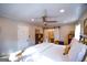 Comfortable main bedroom with a ceiling fan and barn door access to the attached ensuite bathroom at 577 Rivers Rd, Fayetteville, GA 30214