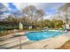 Backyard pool with inground pool and surrounding fence and landscaping at 577 Rivers Rd, Fayetteville, GA 30214