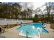 Backyard pool with pool accessories and surrounding fence and landscaping at 577 Rivers Rd, Fayetteville, GA 30214